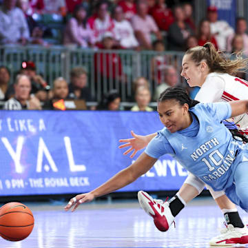 Nov 25, 2024; Paradise Island, Bahamas, BHS; North Carolina Tar Heels guard Reniya Kelly (10) and Indiana Hoosiers guard Shay Ciezki (10) go for a loose ball during the second half at the Atlantis Resort. Mandatory Credit: Kevin Jairaj-Imagn Images