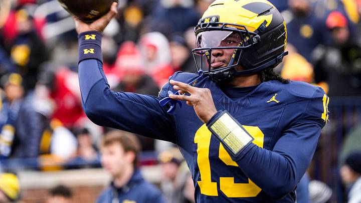 Michigan quarterback Bryce Underwood (19) warms up at Michigan Stadium in Ann Arbor on Saturday, Nov. 29, 2025.