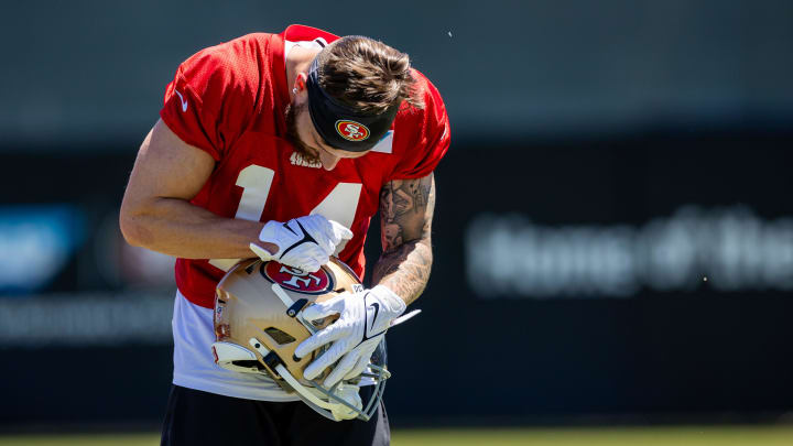 May 10, 2024; Santa Clara, CA, USA; San Francisco 49ers wide receiver Ricky Pearsall (14) polishes the 49ers logo on his helmet during the 49ers rookie minicamp at Levi’s Stadium in Santa Clara, CA. Mandatory Credit: Robert Kupbens-USA TODAY Sports