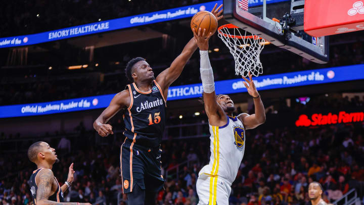 Mar 17, 2023; Atlanta, Georgia, USA; Atlanta Hawks center Clint Capela (15) blocks the shot of Golden State Warriors forward Kevon Looney (5) in the second half at State Farm Arena. Mandatory Credit: Brett Davis-USA TODAY Sports