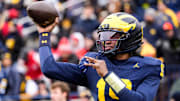 Michigan quarterback Bryce Underwood (19) warms up at Michigan Stadium in Ann Arbor on Saturday, Nov. 29, 2025.
