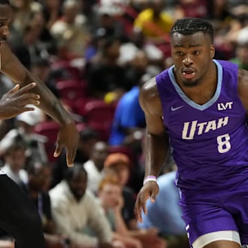 Jul 14, 2025; Las Vegas, NV, USA;  Utah Jazz guard Isaiah Collier (8) dribbles the ball against San Antonio Spurs forward David Jones-Garcia (25) during the first half of a NBA basketball game at the Thomas & Mack Center. Mandatory Credit: Lucas Peltier-Imagn Images