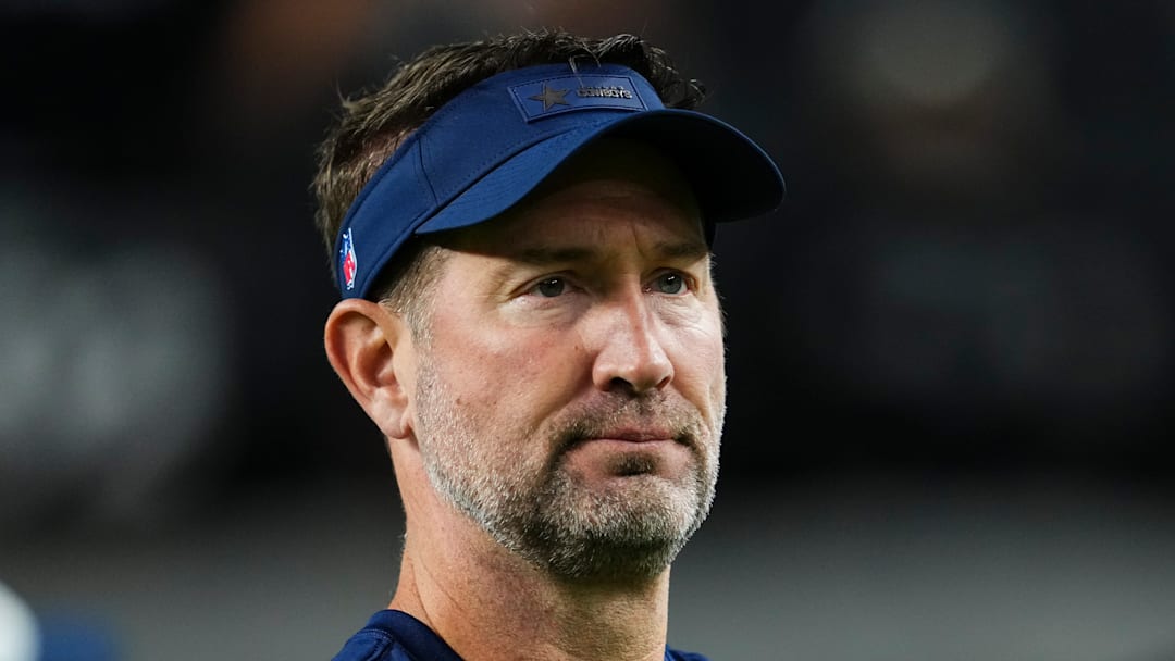 Dallas Cowboys head coach Brian Schottenheimer takes a break