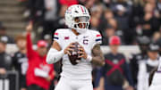 Nov 15, 2025; Cincinnati, Ohio, USA;  Arizona Wildcats quarterback Noah Fifita (1) drops back to pass against the Cincinnati Bearcats in the first half at Nippert Stadium. Mandatory Credit: Aaron Doster-Imagn Images