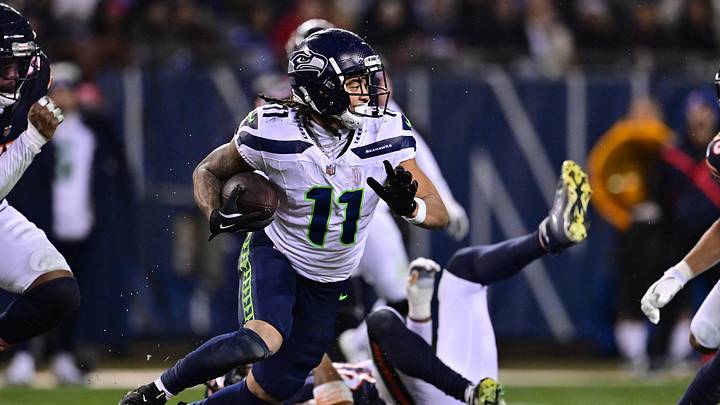 Dec 26, 2024; Chicago, Illinois, USA; Seattle Seahawks wide receiver Jaxon Smith-Njigba (11) runs after a catch against the Chicago Bears during the third quarter at Soldier Field. Mandatory Credit: Daniel Bartel-Imagn Images