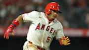Jul 28, 2025; Anaheim, California, USA;  Los Angeles Angels right fielder Gustavo Campero (51) singles in the sixth inning against the Texas Rangers at Angel Stadium. Mandatory Credit: Jayne Kamin-Oncea-Imagn Images