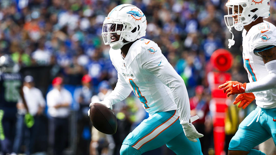 Miami Dolphins cornerback Kader Kohou (4) celebrates following an interception against the Seattle Seahawks during the first quarter at Lumen Field. 