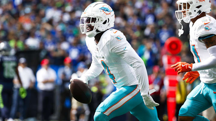Miami Dolphins cornerback Kader Kohou (4) celebrates following an interception against the Seattle Seahawks during the first quarter at Lumen Field. Miami Dolphins cornerback Kader Kohou (4) celebrates following an interception against the Seattle Seahawks during the first quarter at Lumen Field.