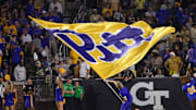Nov 22, 2025; Atlanta, Georgia, USA; Pittsburgh Panthers cheerleader waves a flag after a touchdown against the Georgia Tech Yellow Jackets in the fourth quarter at Bobby Dodd Stadium at Hyundai Field. Mandatory Credit: Brett Davis-Imagn Images