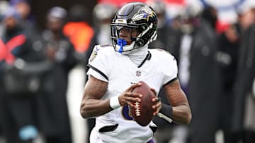 Dec 15, 2024; East Rutherford, New Jersey, USA; Baltimore Ravens quarterback Lamar Jackson (8) scrambles during the first quarter against the New York Giants at MetLife Stadium. Mandatory Credit: Vincent Carchietta-Imagn Images
