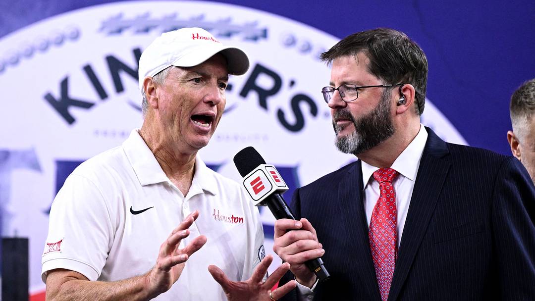 Dec 27, 2025; Houston, TX, USA; Houston Cougars head coach Willie Fritz speak with an ESPN sports caster after the win over Louisiana State Tigers at NRG Stadium. Mandatory Credit: Maria Lysaker-Imagn Images