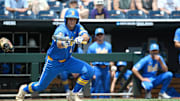 Jun 14, 2025; Omaha, Neb, USA;  UCLA Bruins shortstop Roch Cholowsky (1) bunts in a run against the Murray State Racers during the fourth inning at Charles Schwab Field. Mandatory Credit: Steven Branscombe-Imagn Images