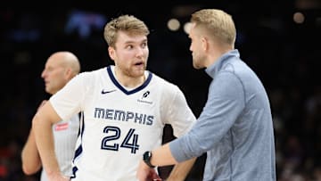 Oct 29, 2025; Phoenix, Arizona, USA; Grizzlies' guard Cam Spencer (24) receiving instructions from head coach Tuomas Iisalo during the Grizzlies' victory against the Phoenix Suns. 