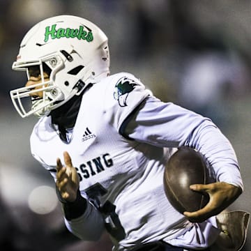 Great Crossing quarterback Jeremiah Clark (5) runs with the ball against Ryle in the first half at Ryle High School Nov. 29, 2024.