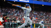 Jul 10, 2024; San Francisco, California, USA; Toronto Blue Jays first base Justin Turner (2) hits a RBI single during the sixth inning against the San Francisco Giants at Oracle Park. Mandatory Credit: Sergio Estrada-USA TODAY Sports