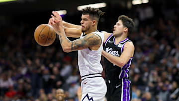Dec 16, 2024; Sacramento, California, USA; Denver Nuggets forward Michael Porter Jr. (1) and Sacramento Kings forward Doug McDermott (7) fight for the ball during the third quarter at Golden 1 Center. Mandatory Credit: Sergio Estrada-Imagn Images