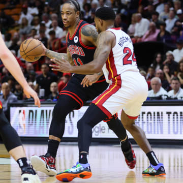 Apr 19, 2024; Miami, Florida, USA; Chicago Bulls forward DeMar DeRozan (11) dribbles the basketball as Miami Heat forward Haywood Highsmith (24) defends in the first quarter during a play-in game of the 2024 NBA playoffs at Kaseya Center. Mandatory Credit: Sam Navarro-USA TODAY Sports