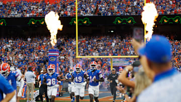 Aug 30, 2025; Gainesville, Florida, USA; Florida Gators defensive back Vincent Brown Jr. (36), Florida Gators edge Jalen Wiggins (49) and Florida Gators defensive back Jordan Castell (14) run onto the field before a game against the Long Island Sharks at Ben Hill Griffin Stadium. Mandatory Credit: Matt Pendleton-Imagn Images