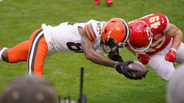 Jan 17, 2021; Kansas City, Missouri, USA; Cleveland Browns wide receiver Rashard Higgins (82) moves the ball on a scoring attempt against Kansas City Chiefs free safety Daniel Sorensen (49) during the first half in the AFC Divisional Round playoff game at Arrowhead Stadium. Mandatory Credit: Denny Medley-USA TODAY Sports
