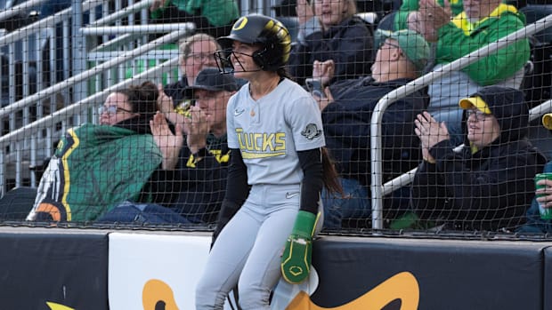 Oregon’s Kai Luschar takes in the scene after scoring the first run for the Ducks against Weber State during the Eugene NCAA 