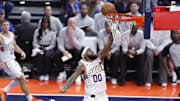 Dec 10, 2025; Oklahoma City, Oklahoma, USA; Phoenix Suns forward Royce O'Neale (00) goes to the basket against the Oklahoma City Thunder during the third quarter at Paycom Center. Mandatory Credit: Alonzo Adams-Imagn Images