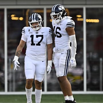 Sep 6, 2024; Dallas, Texas, USA; Brigham Young Cougars linebacker Jack Kelly (17) and linebacker Isaiah Glasker (16) in action during the game between the Southern Methodist Mustangs and the Brigham Young Cougars at Gerald J. Ford Stadium.