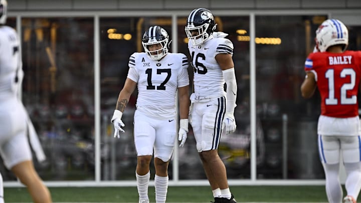 Sep 6, 2024; Dallas, Texas, USA; Brigham Young Cougars linebacker Jack Kelly (17) and linebacker Isaiah Glasker (16) in action during the game between the Southern Methodist Mustangs and the Brigham Young Cougars at Gerald J. Ford Stadium.