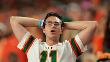 Oct 17, 2025; Miami Gardens, Florida, USA; A Miami Hurricanes fan reacts against the Louisville Cardinals during the third quarter at Hard Rock Stadium. Mandatory Credit: Sam Navarro-Imagn Images