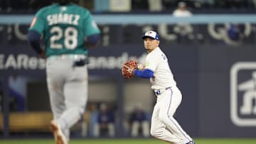 Oct 19, 2025; Toronto, Ontario, CAN; Toronto Blue Jays second baseman Andres Gimenez (0) makes a throw to first for a double play against Seattle Mariners third baseman Eugenio Suarez (28) and shortstop J.P. Crawford (not pictured) in the fourth inning during game six of the ALCS round for the 2025 MLB playoffs at Rogers Centre. Mandatory Credit: John E. Sokolowski-Imagn Images