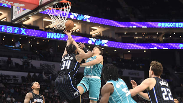 Charlotte Hornets Forward Tidjane Salaun (31) led as he is defended by Orlando Magic Center Wendell Carter Jr. (34)