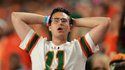 Oct 17, 2025; Miami Gardens, Florida, USA; A Miami Hurricanes fans reacts from the stands against the Louisville Cardinals during the third quarter at Hard Rock Stadium. Mandatory Credit: Sam Navarro-Imagn Images