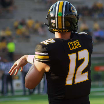 Missouri Tigers quarterback Brady Cook follows through on a pass during warm ups at Faurot Field ahead of a game against Murray State In Columbia, Mo. on Tuesday, August 13, 2024.