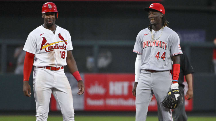 Cincinnati Reds shortstop Elly De La Cruz (44) and St. Louis Cardinals outfielder Jordan Walker (18)