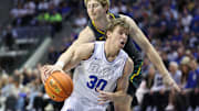 Feb 20, 2024; Provo, Utah, USA; Baylor Bears forward Caleb Lohner (rear) knocks the ball away from Brigham Young Cougars guard Dallin Hall (30) during the second half at Marriott Center. Mandatory Credit: Rob Gray-USA TODAY Sports