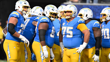 Nov 10, 2024; Inglewood, California, USA; Los Angeles Chargers offensive tackle Joe Alt (76), quarterback Justin Herbert (10), guard Jamaree Salyer (68), fullback Scott Matlock (44), center Bradley Bozeman (75), guard Zion Johnson (77), and offensive tackle Rashawn Slater (70) during and NFL game against the Tennessee Titans at SoFi Stadium. Mandatory Credit: Robert Hanashiro-Imagn Images