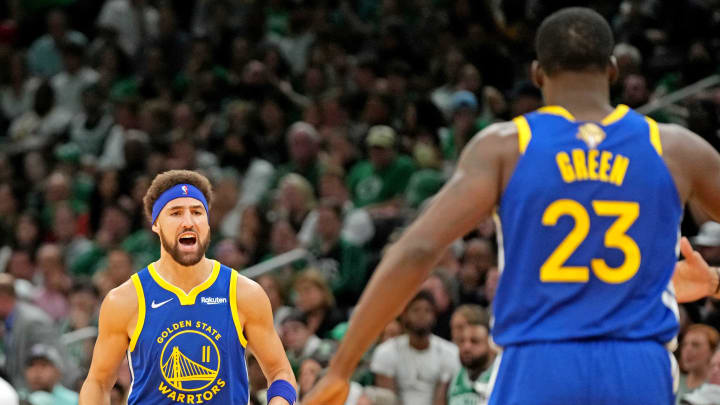 Jun 16, 2022; Boston, Massachusetts, USA; Golden State Warriors guard Klay Thompson (11) reacts with forward Draymond Green (23) after a play against the Boston Celtics in game six of the 2022 NBA Finals at TD Garden. Mandatory Credit: Kyle Terada-USA TODAY Sports