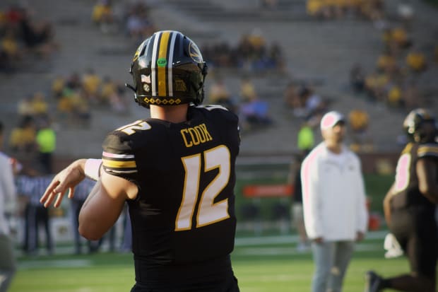 Missouri Tigers quarterback Brady Cook (12) warms up prior to his team's matchup against the Murray State Racers.