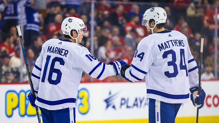 Jan 18, 2024; Calgary, Alberta, CAN; Toronto Maple Leafs right wing Mitchell Marner (16) celebrates his goal with center Auston Matthews (34) during the second period against the Calgary Flames at Scotiabank Saddledome. Mandatory Credit: Sergei Belski-Imagn Images