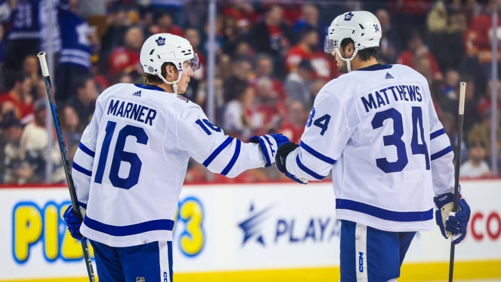 Jan 18, 2024; Calgary, Alberta, CAN; Toronto Maple Leafs right wing Mitchell Marner (16) celebrates his goal with center Auston Matthews (34) during the second period against the Calgary Flames at Scotiabank Saddledome. Mandatory Credit: Sergei Belski-USA TODAY Sports