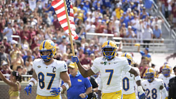 Oct 11, 2025; Tallahassee, Florida, USA; Pittsburgh Panthers wide receiver Deuce Spann (7) carries the American Flag before the game against the Florida State Seminoles at Doak S. Campbell Stadium. Mandatory Credit: Melina Myers-Imagn Images