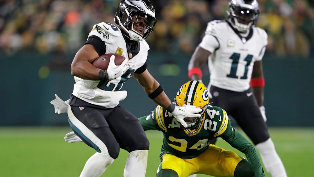 Green Bay Packers cornerback Carrington Valentine (24) misses a tackle against Philadelphia Eagles running back Saquon Barkley (26) on a long gain in the fourth quarter during their football game Monday, November 10, 2025, at Lambeau Field in Green Bay, Wisconsin. Green Bay Packers cornerback Carrington Valentine (24) misses a tackle against Philadelphia Eagles running back Saquon Barkley (26) on a long gain in the fourth quarter during their football game Monday, November 10, 2025, at Lambeau Field in Green Bay, Wisconsin.