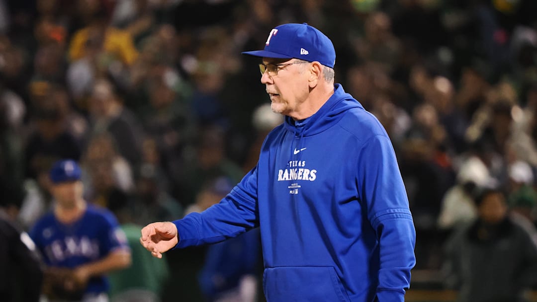 Sep 25, 2024; Oakland, California, USA; Texas Rangers manager Bruce Bochy (15) walks onto the field to replace the pitcher against the Oakland Athletics during the fourth inning at Oakland-Alameda County Coliseum. Mandatory Credit: Kelley L Cox-Imagn Images