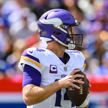 Sep 8, 2024; East Rutherford, New Jersey, USA; Minnesota Vikings quarterback Sam Darnold (14) drops back to pass against the New York Giants during the first half at MetLife Stadium. Mandatory Credit: John Jones-Imagn Images