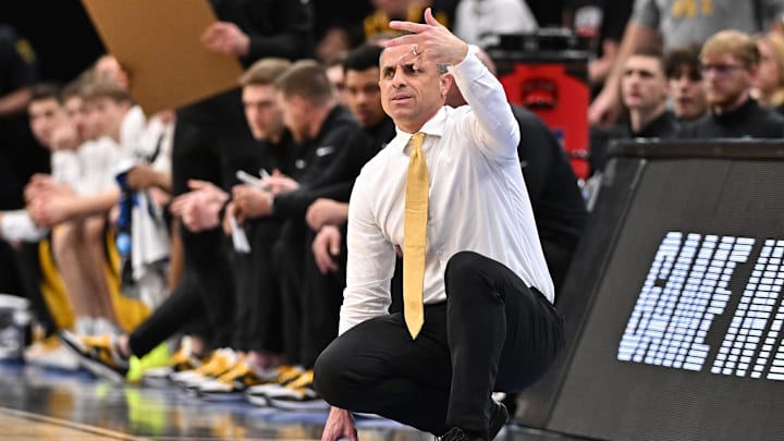 Mar 28, 2026; Houston, TX, USA; Iowa Hawkeyes head coach Ben McCollum looks on in the first half against the Illinois Fighting Illini during an Elite Eight game of the South Regional of the men's 2026 NCAA Tournament at Toyota Center. Mandatory Credit: Maria Lysaker-Imagn Images