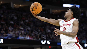 Mar 21, 2025; Cleveland, OH, USA; Alabama Crimson Tide guard Aden Holloway (2) shoots the ball in the second half during the NCAA Tournament First Round at Rocket Arena. Mandatory Credit: Rick Osentoski-Imagn Images