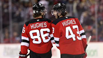 Jack Hughes (Devils forward #86) and Luke Hughes (Devils defenseman #43)