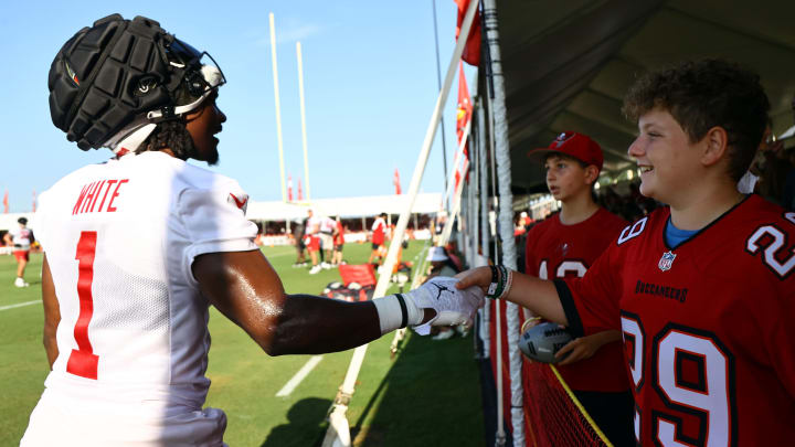Jul 30, 2023; Tampa, FL, USA; Tampa Bay Buccaneers running back Rachaad White (1) talks with fans during training camp at AdventHealth Training Center. Mandatory Credit: Kim Klement-USA TODAY Sports