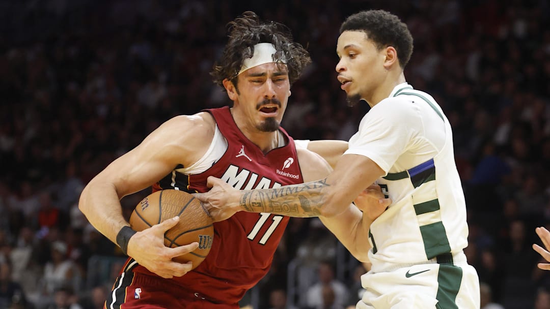Nov 26, 2025; Miami, Florida, USA; Milwaukee Bucks guard Ryan Rollins (13) defends Miami Heat forward Jaime Jaquez Jr. (11) during the second half of an NBA Cup game at Kaseya Center. Mandatory Credit: Rhona Wise-Imagn Images Nov 26, 2025; Miami, Florida, USA; Milwaukee Bucks guard Ryan Rollins (13) defends Miami Heat forward Jaime Jaquez Jr. (11) during the second half of an NBA Cup game at Kaseya Center. Mandatory Credit: Rhona Wise-Imagn Images