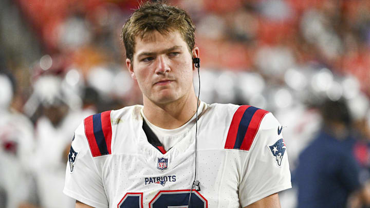 New England Patriots quarterback Drake Maye (10) stands in the bench area during the second  half at Commanders Field.