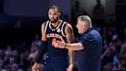 Feb 11, 2025; Nashville, Tennessee, USA;  Auburn Tigers head coach Bruce Pearl talks with forward Johni Broome (4) against the Vanderbilt Commodores during the first half at Memorial Gymnasium. Mandatory Credit: Steve Roberts-Imagn Images
